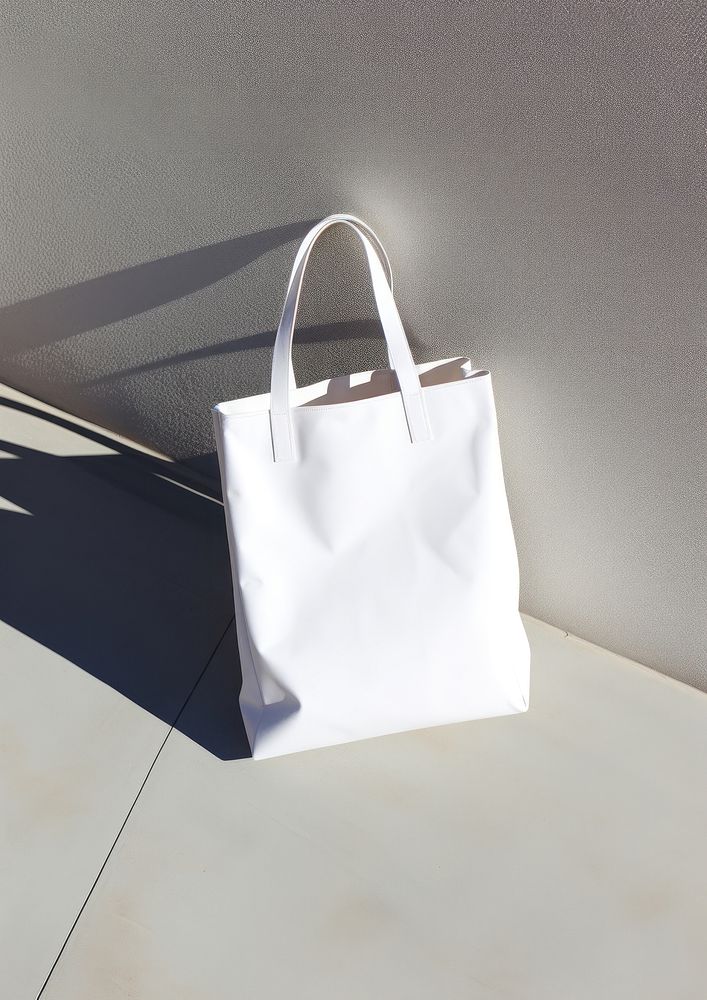 A white tote bag handbag accessories accessory.