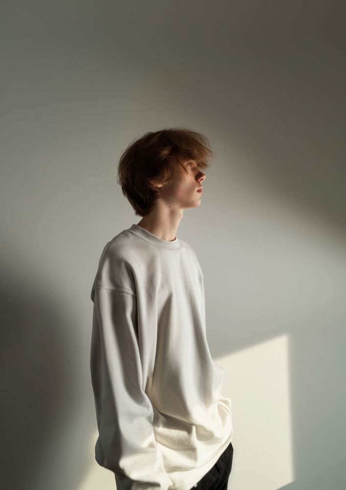 Teenager long sleeve streetwear portrait photo contemplation.