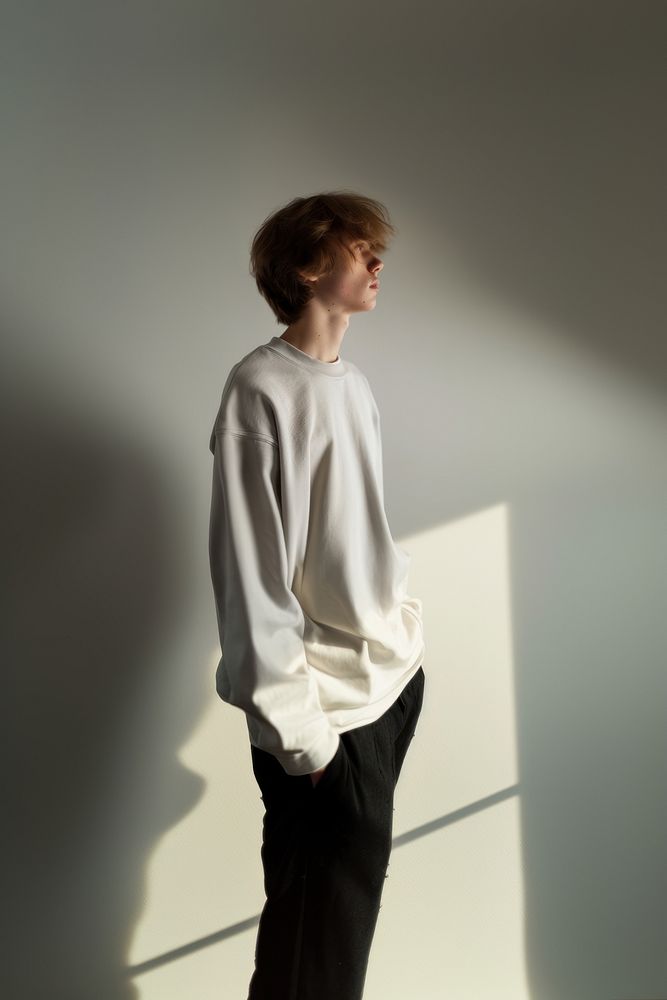 Teenager long sleeve streetwear contemplation outerwear portrait.