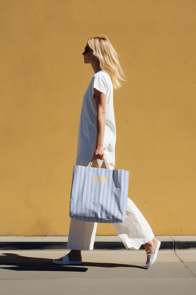 Woman walking with tote bag