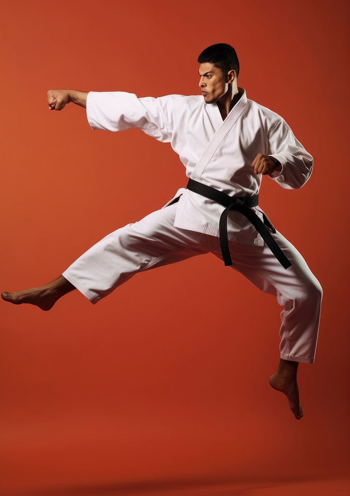 Karate black belt kicking sports adult male.
