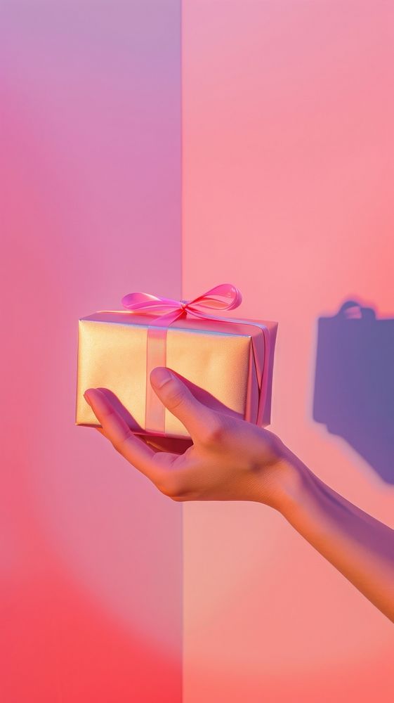 Hand holding gift box adult pink red.