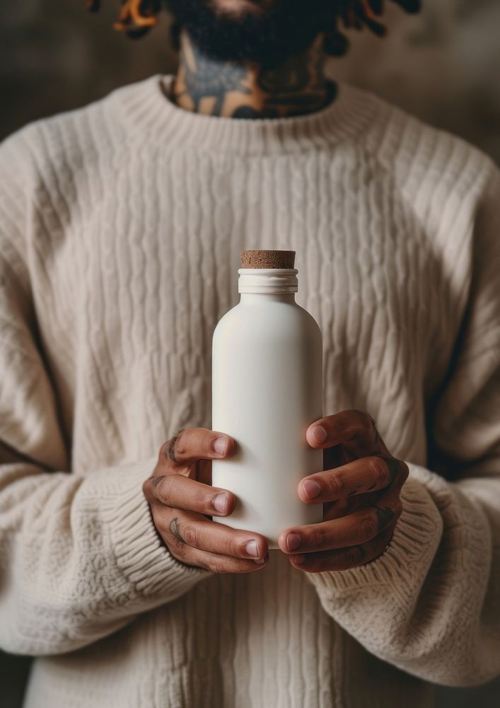 Man holding a bottle of milk drink white refreshment.