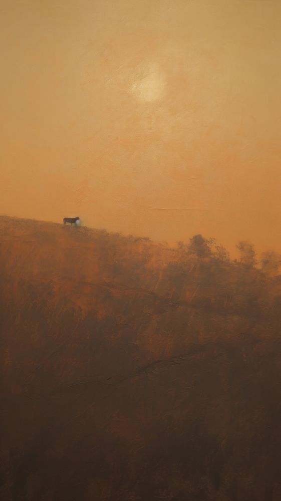 Lonely cow grazing in the setting sun painting backgrounds outdoors.