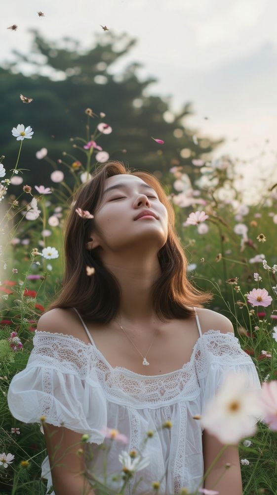 Woman in garden with flying flowers portrait plant adult.