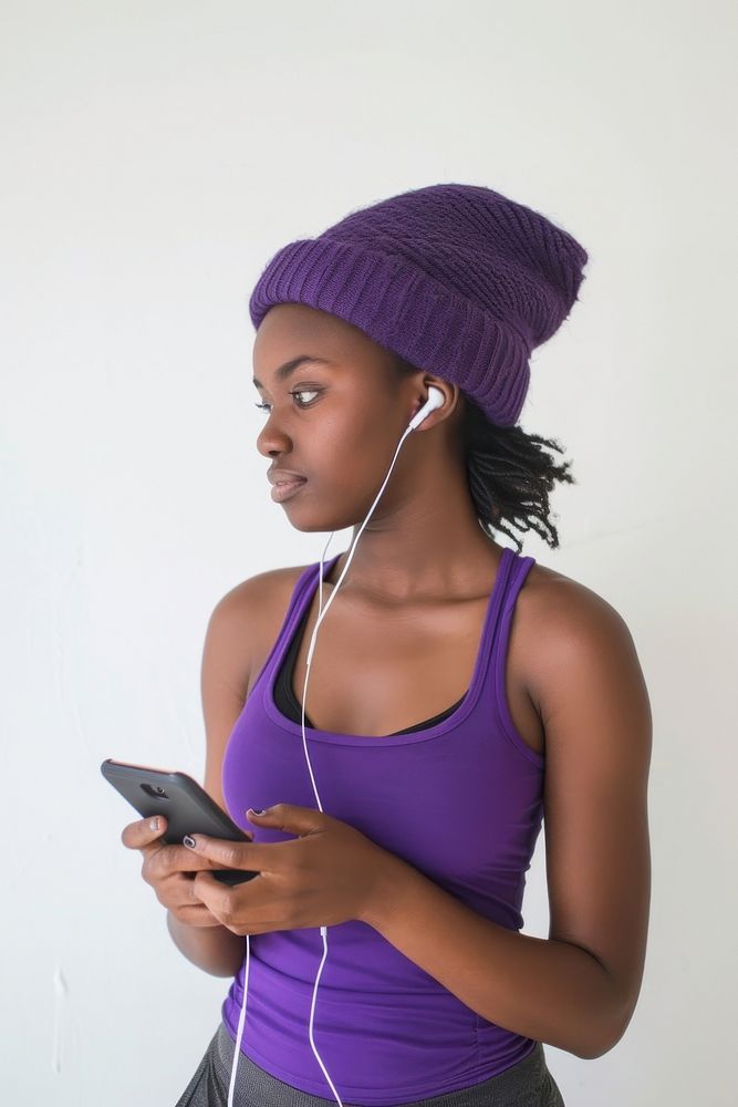 Women using using smart phone and Earbuds earbuds purple adult.