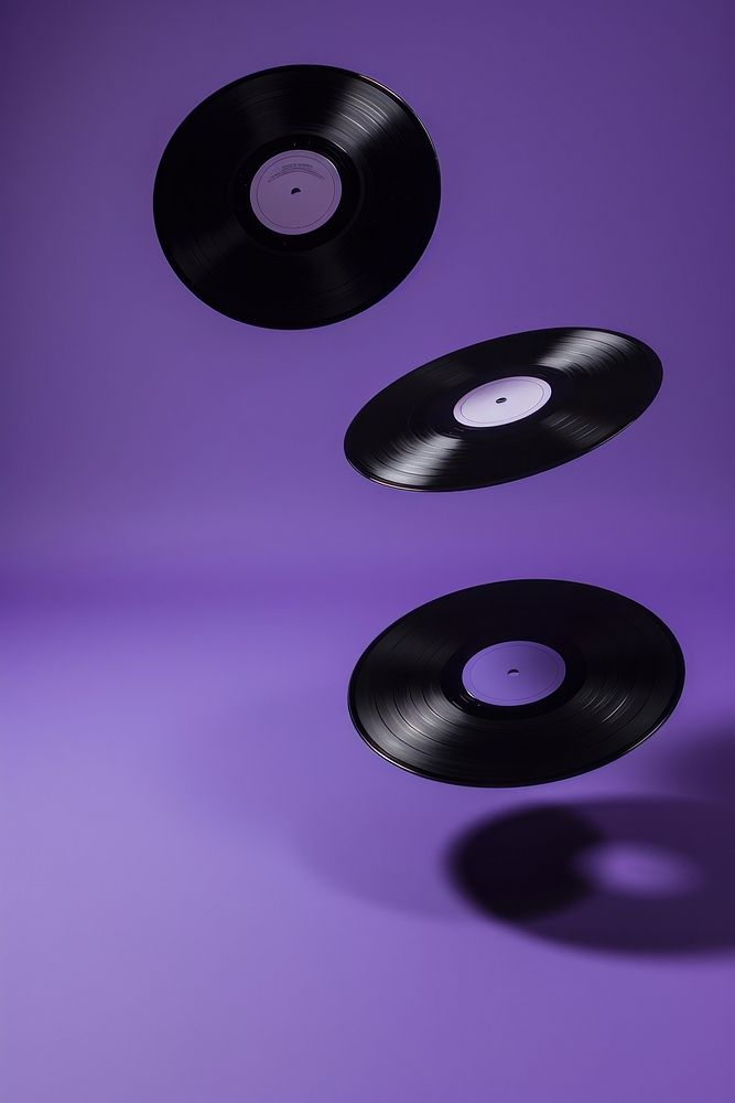 Photo of 3 vinyl purple gramophone turntable.