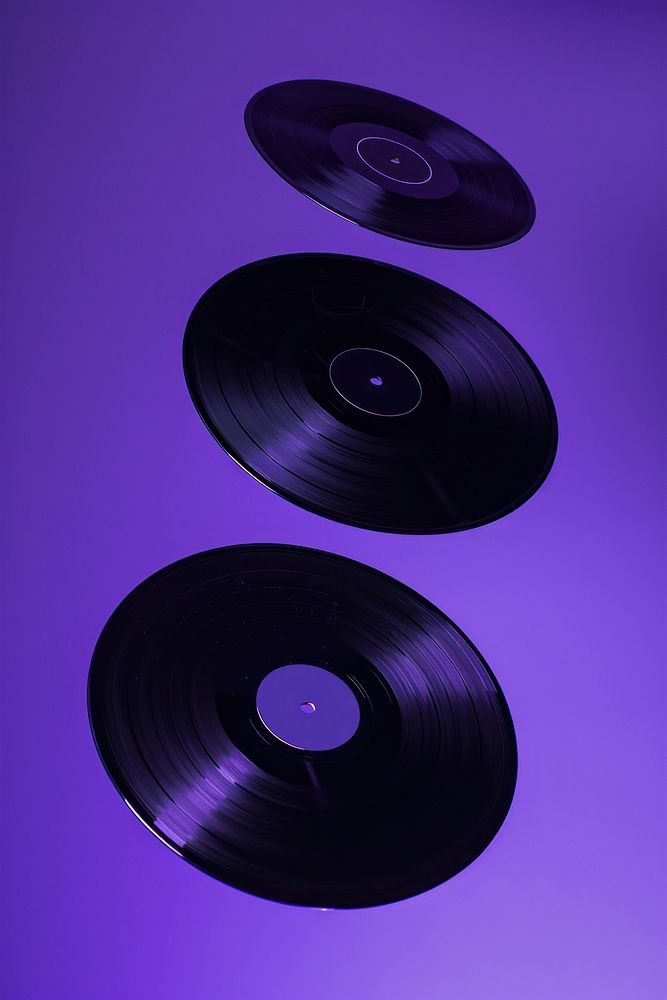 Photo of 3 vinyl purple technology gramophone.