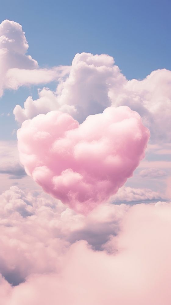 Heart pink clouds in the cute outdoors nature sky.