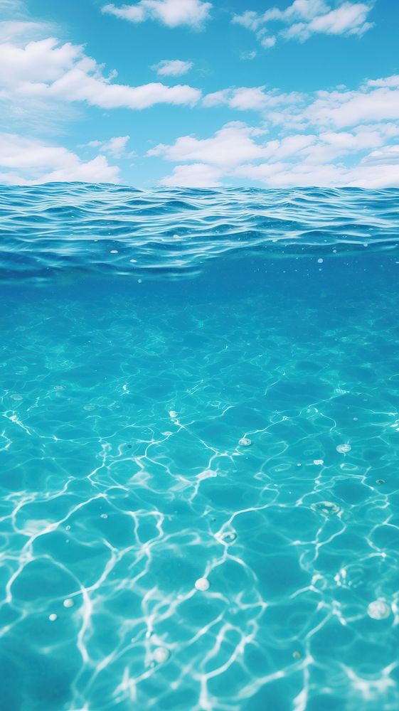 Wallpaper shot of aqua sea water surface underwater outdoors horizon.