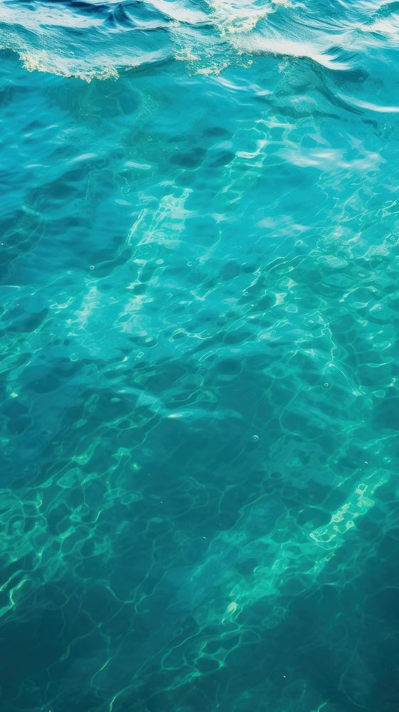 Wallpaper shot of aqua sea water surface underwater outdoors swimming.
