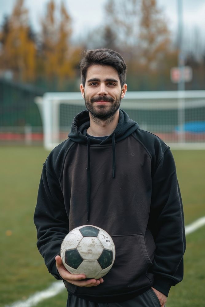 A man holding a soccer ball football sports adult.