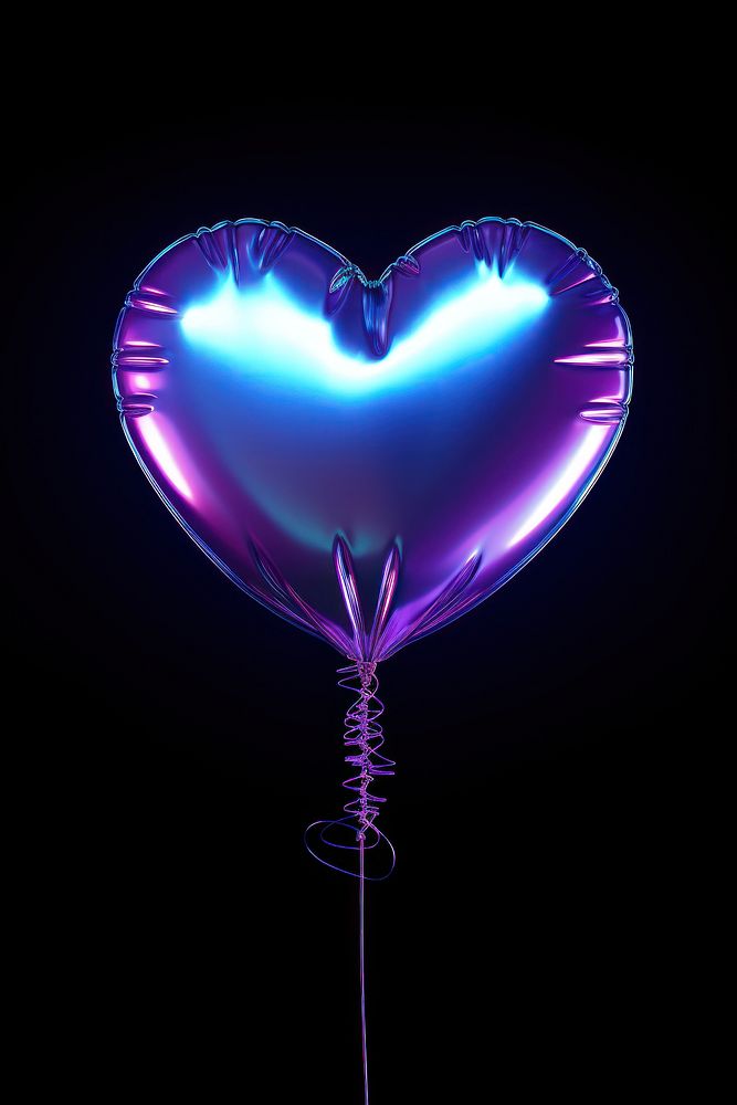 Heart shape balloon light illuminated celebration.