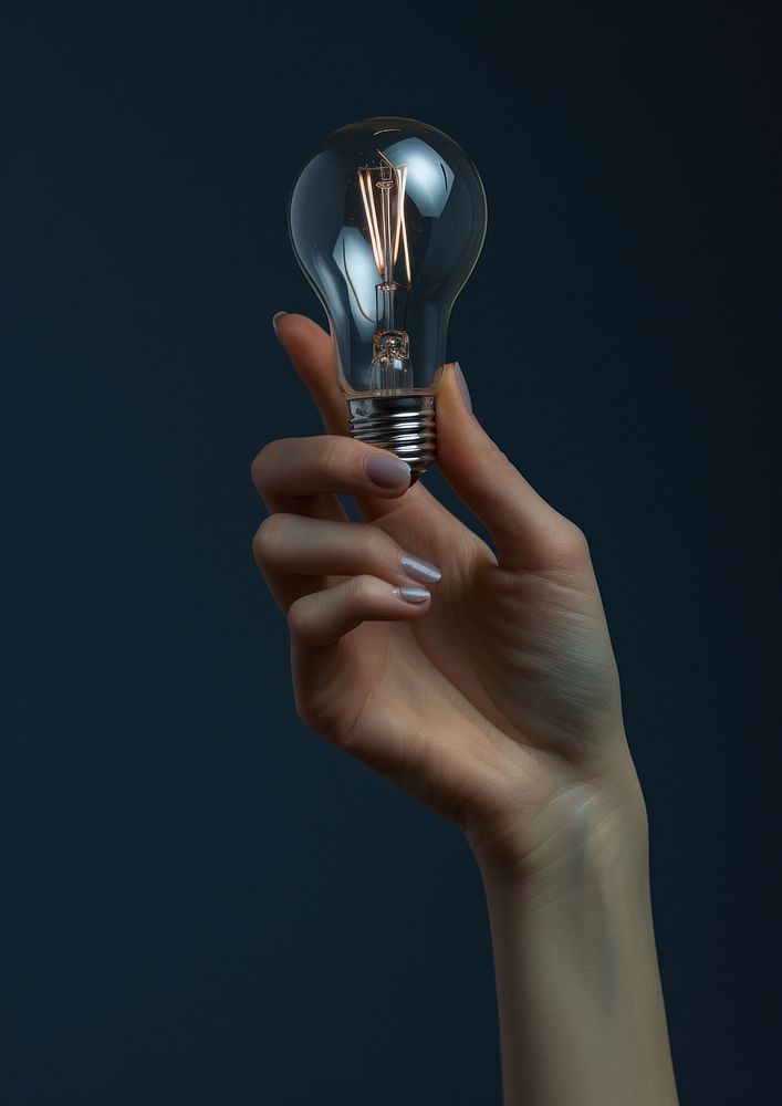 Woman holding light bulb lightbulb adult hand.