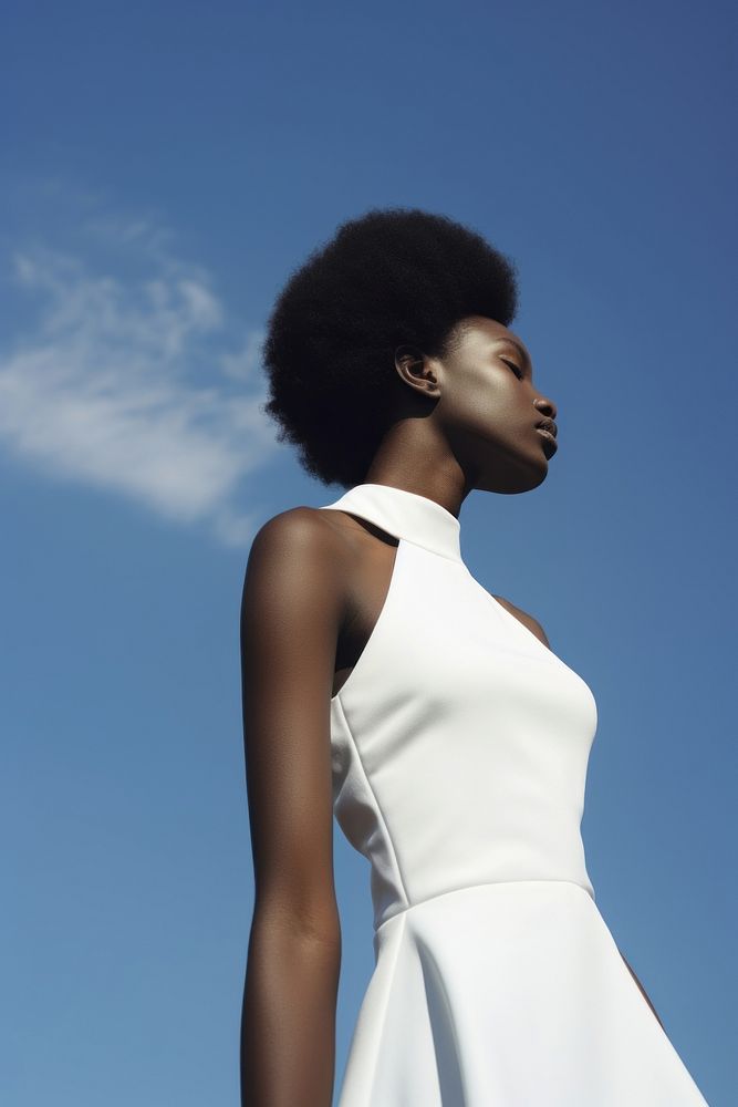 A black teenage woman wearing minimal white dress fashion photography portrait.