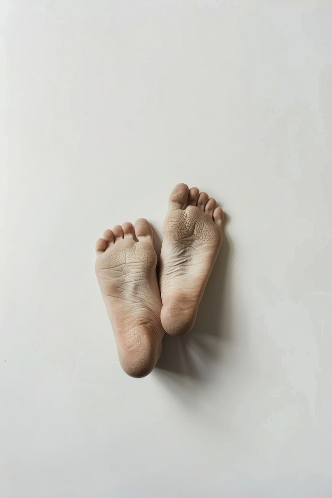 Soles of feet white barefoot footwear.
