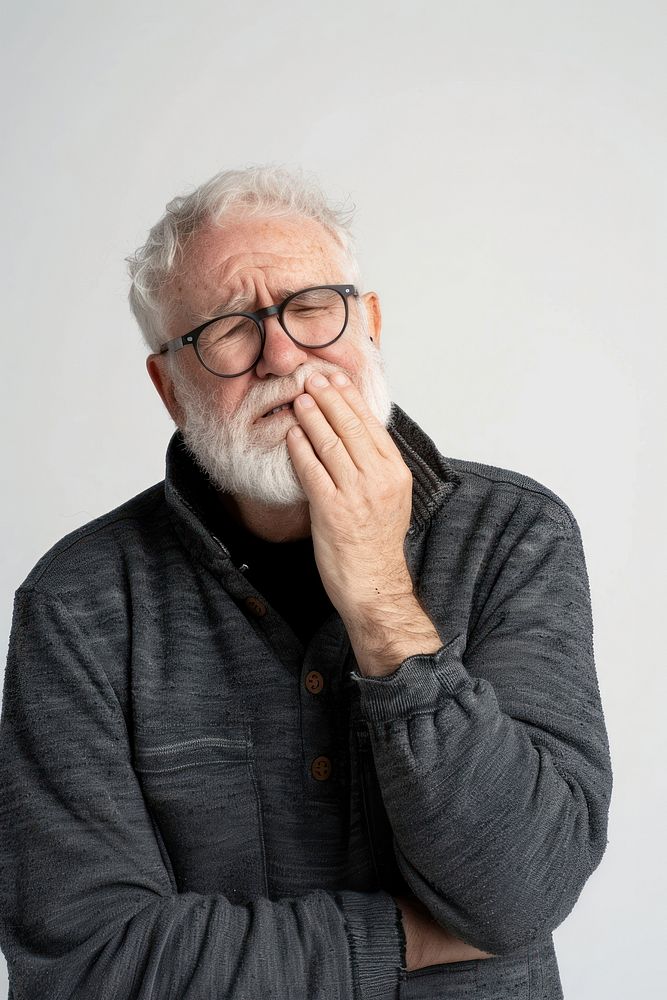 Senior man touching cheek with hand glasses adult pain.