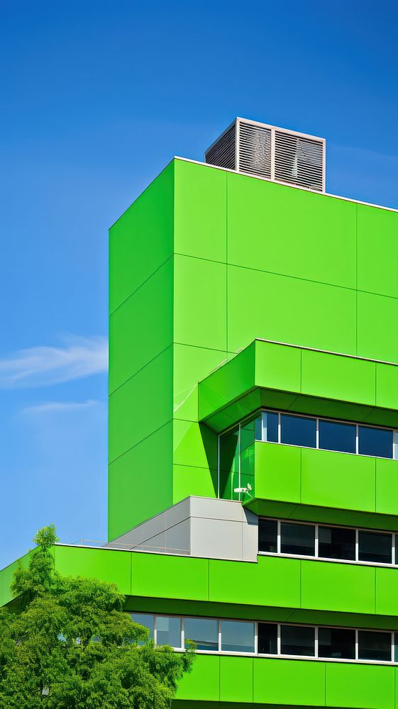 High contrast office building green architecture outdoors.