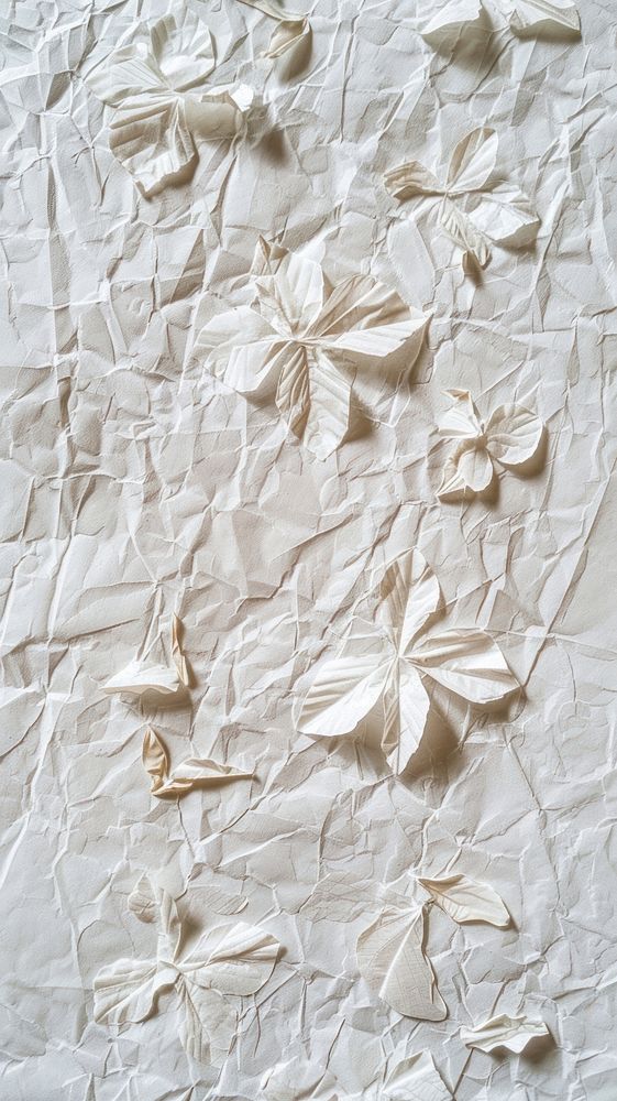 White mulberry paper filled with flower petals textured backgrounds creativity crumpled.