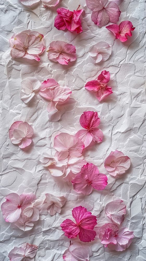 White mulberry paper with flower petals filled textured backgrounds plant fragility.