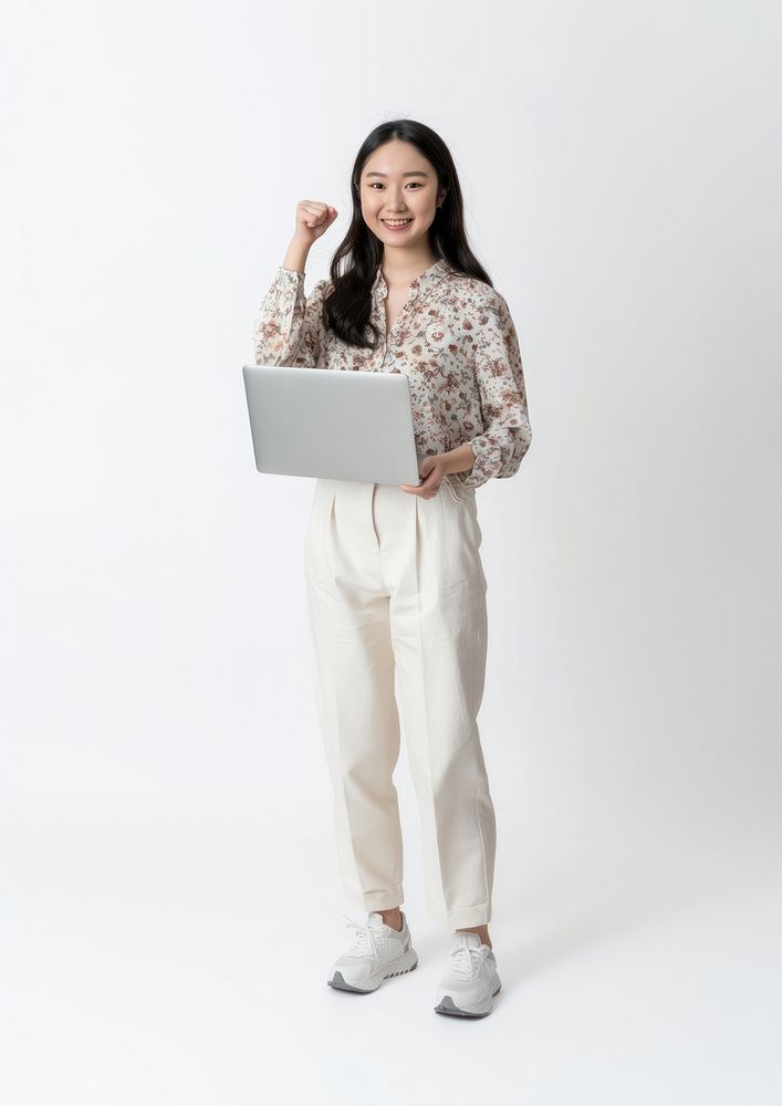 Woman with laptop standing electronics clothing.