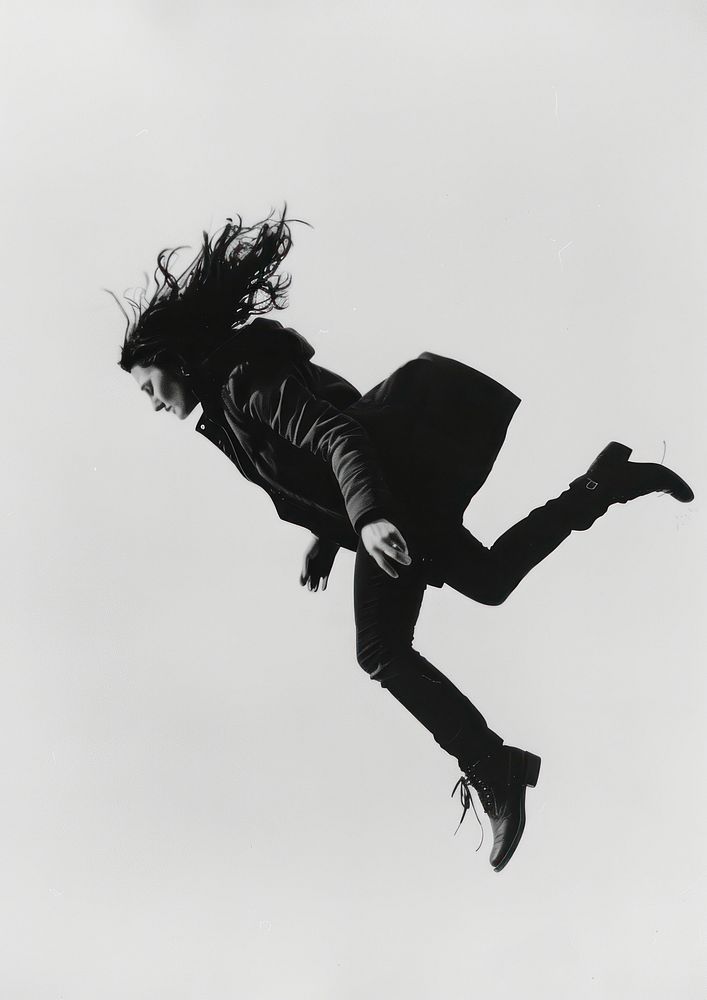 A woman falling headbanging clothing footwear.