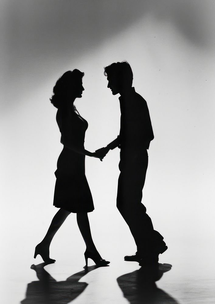 A woman dancing with a man silhouette recreation clothing.