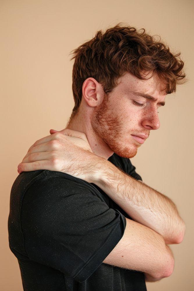 Young man having shoulder pain photo photography portrait.