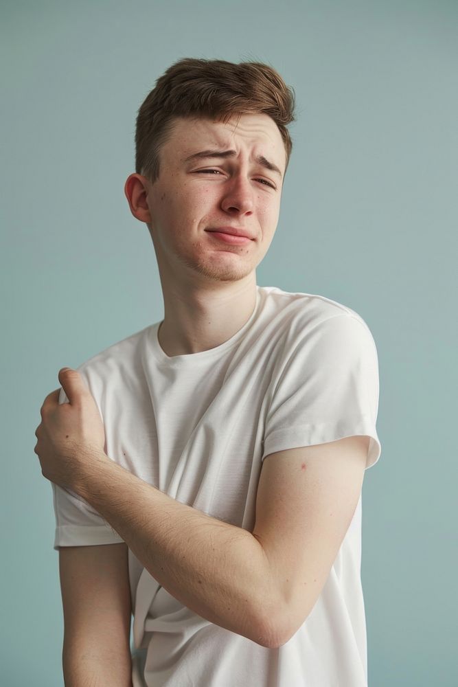 Young man having shoulder pain worried person human.