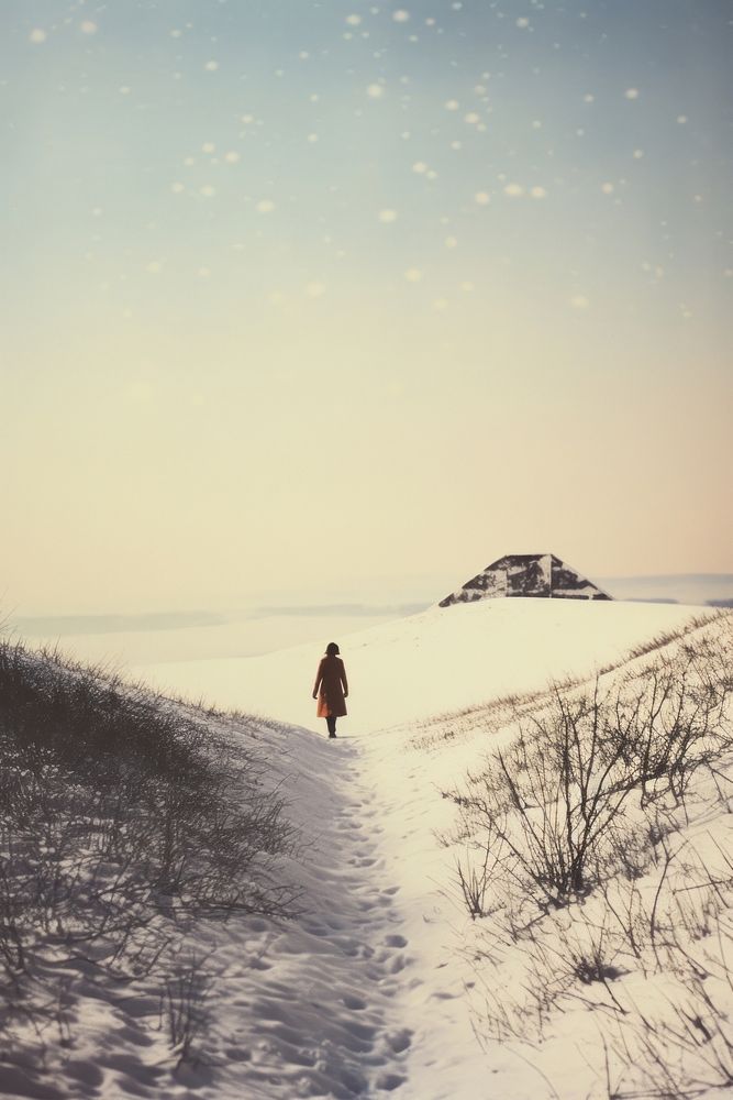 Woman walking in snow landscape photography mountain.