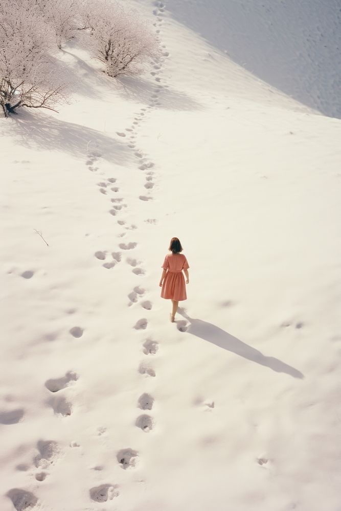 Woman walking in snow photography landscape outdoors.