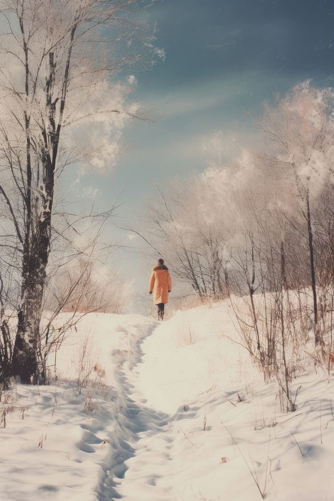 Woman walking in snow landscape photography adventure.