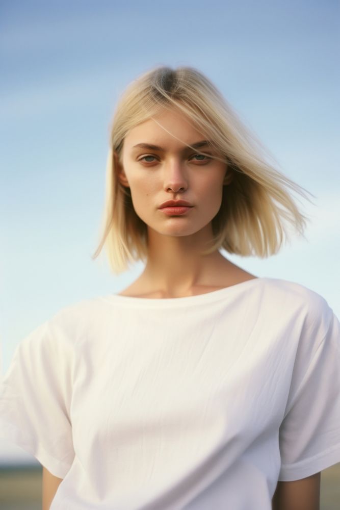 A woman wear white photography portrait blonde.