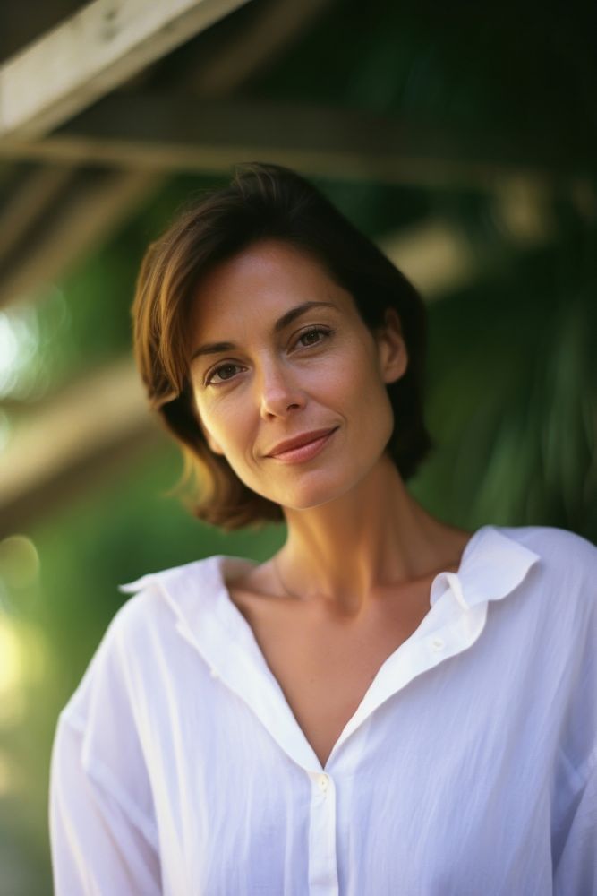 A mature woman wear white photography portrait dimples.