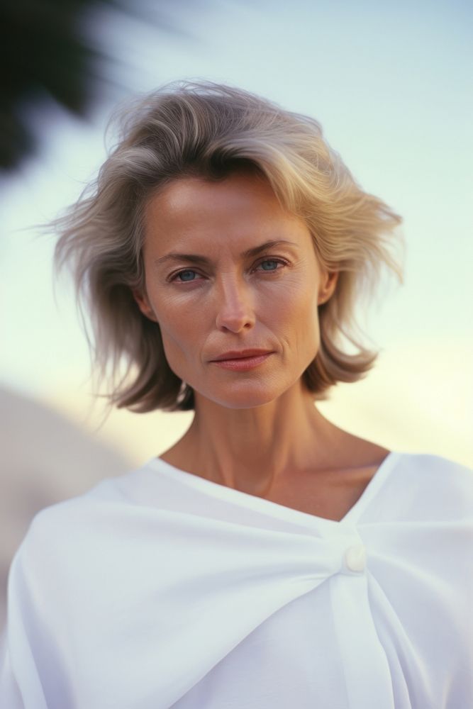 A mature woman wear white photography portrait fashion.