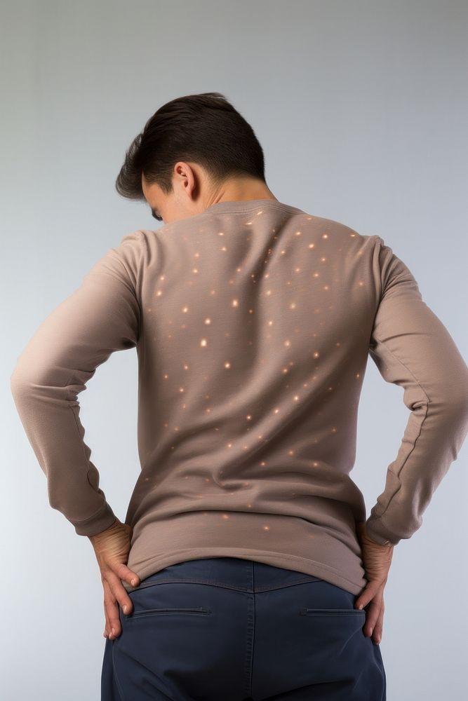 Young man back pain clothing.