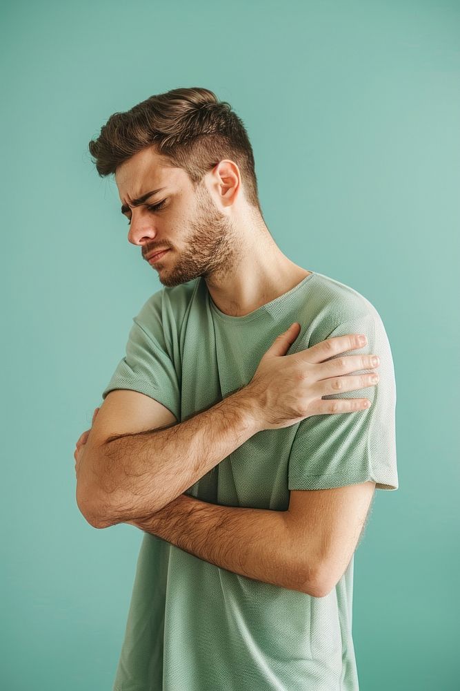Man having shoulder pain clothing apparel person.