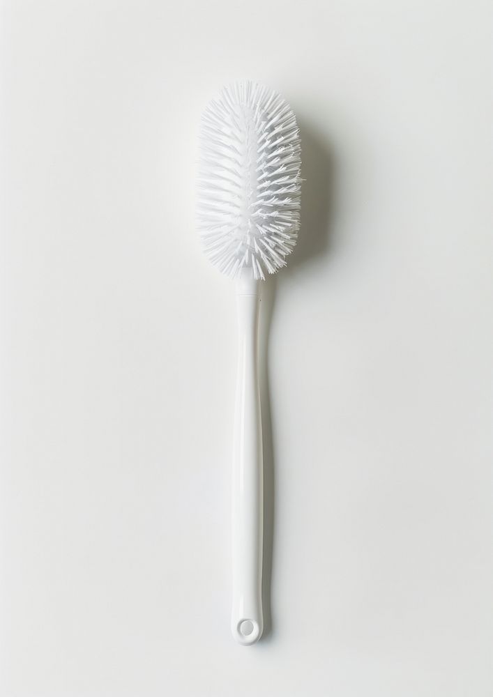 White toilet brush toothbrush device tool.