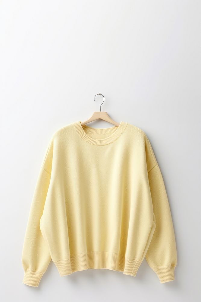 Light pastel yellow sweater sweatshirt blouse white background.