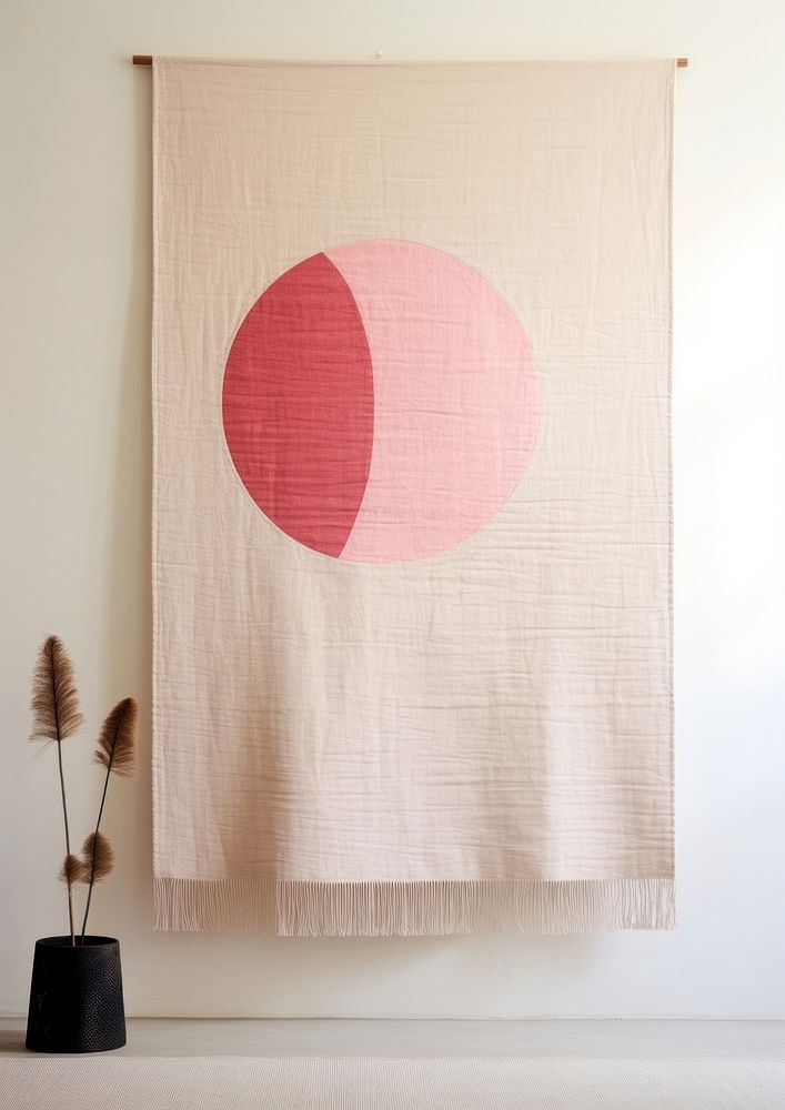 Wall hanging with an abstract pink sun textile art creativity.