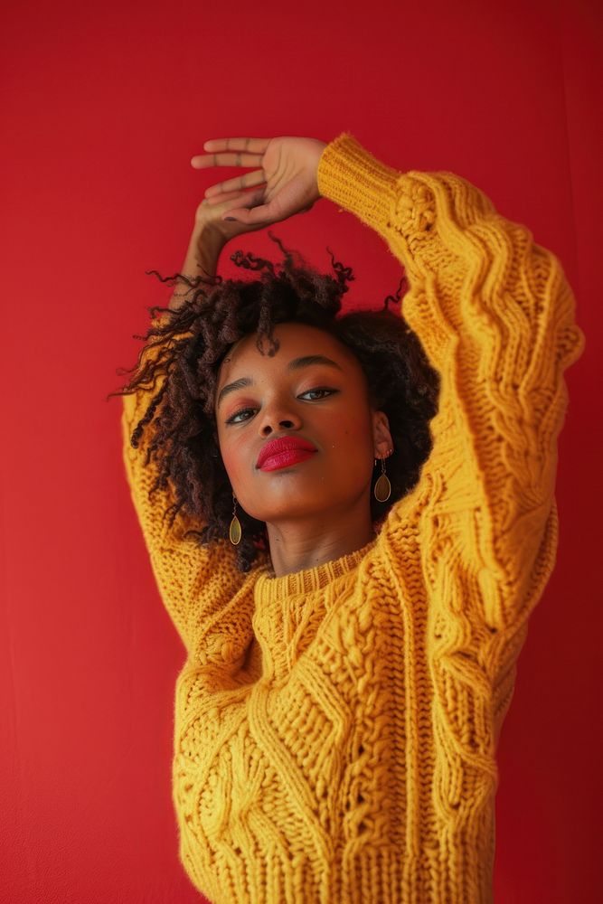 Black woman sweater yellow red.