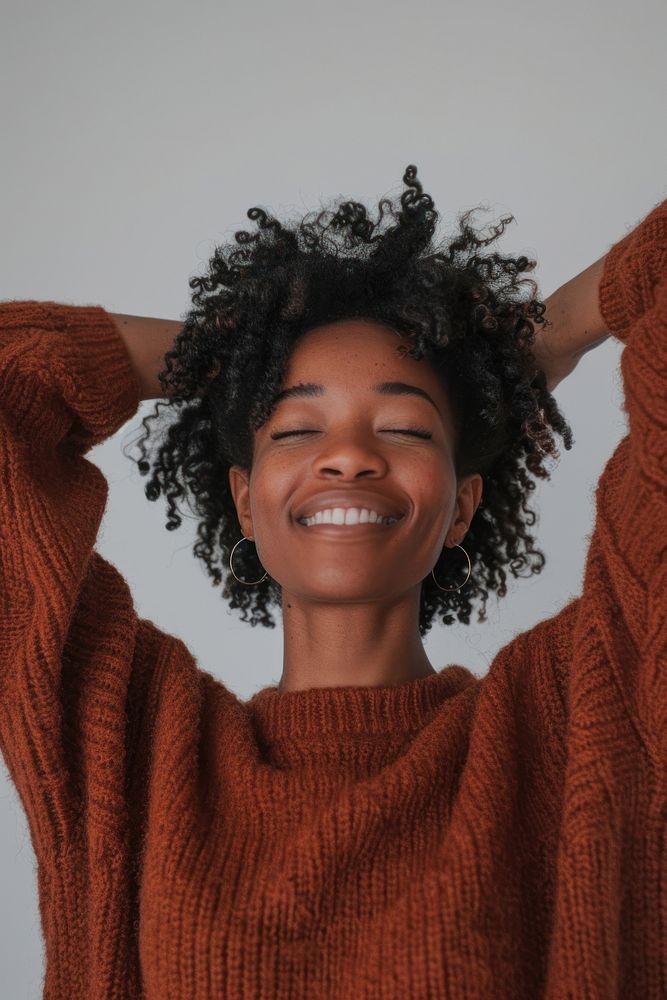 Black woman sweater smiling smile.