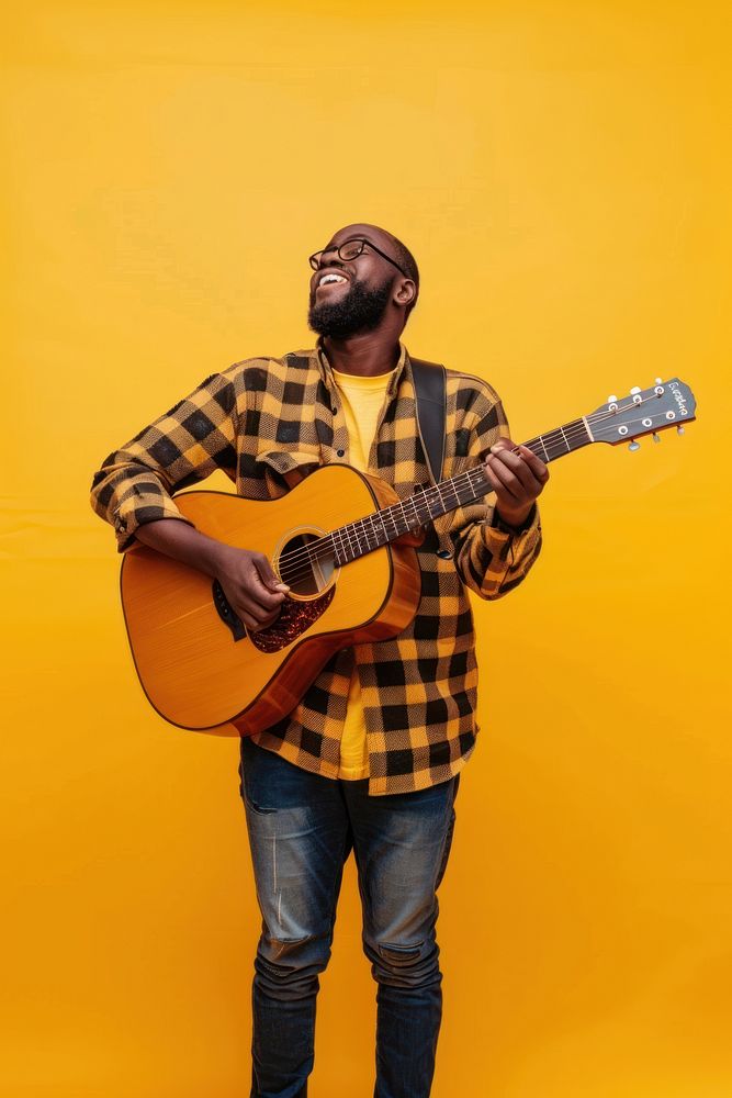 Man holds acoustic guitar and sings musician yellow adult.