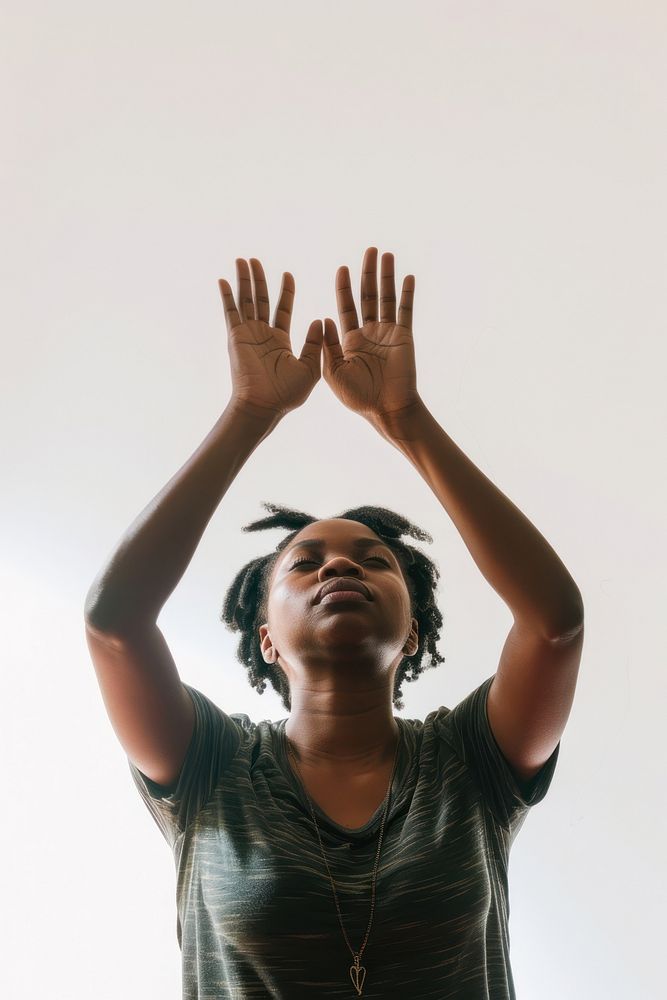 Black adult woman raising hands portrait photo accessories.