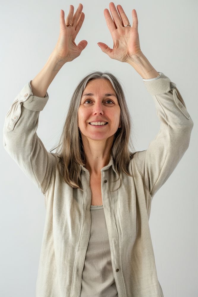 Caucacian adult woman raising hands portrait smile photo.
