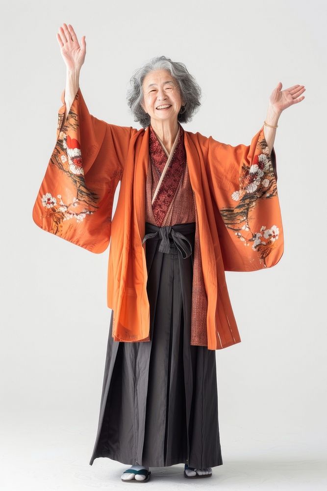 Japanese senior woman raising hands fashion kimono dress.