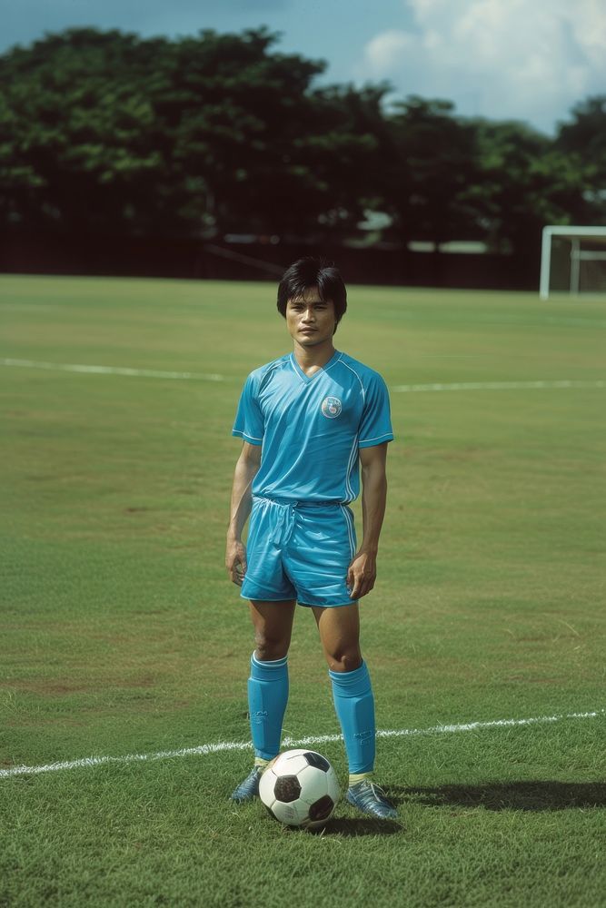 Thai male soccer player football sports grass.