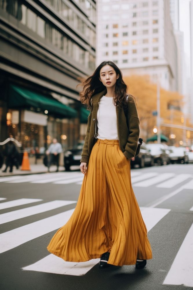 Woman wearing street fashion pedestrian clothing apparel.