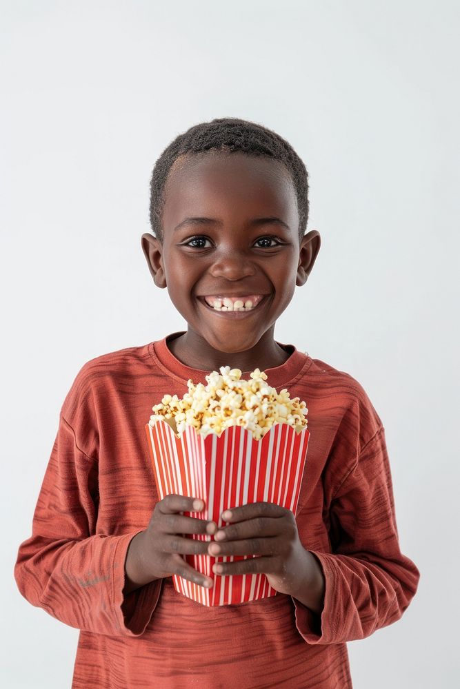 Boy holding popcorn happy clothing knitwear.