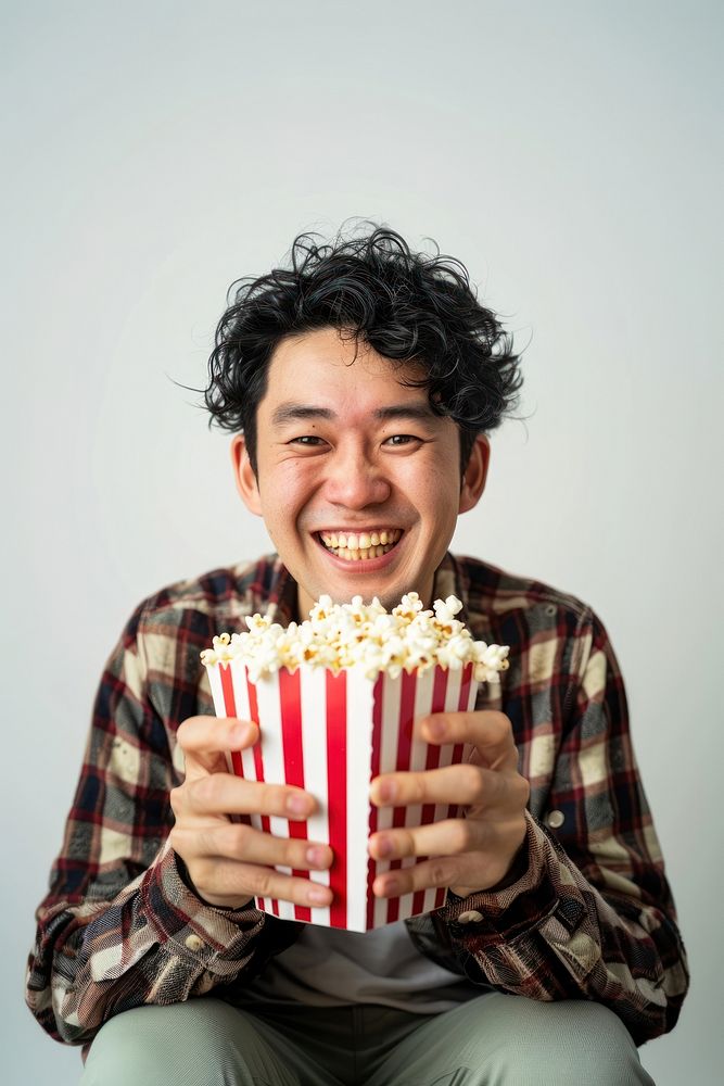 Man holding popcorn happy person human.